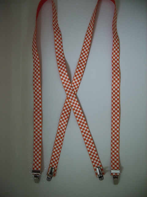 CHECKERS ORANGE AND WHITE 1"x 48" Suspenders with 4 strong 1/2"x1" Grips with nylon Teeth and 2 Length Adjusters in the front, all in high polish Chrome. UC260N48CKOW