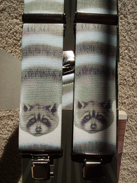 WILDLIFE RACCOON 1 1/2"X48" Suspenders with 4 strong 1"x 1" Stainless Steel Grips and 2 Secure Stainless Steel Length Adjusters in the front. Entirely Stretchable Hand Washable and Hang to Dry Cotton/Polyester Material. UB220N48WLRC