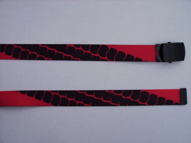 RED TIRE TREAD ON BLACK - High Quality U.S. Made Cotton/Polyester Non-Stretching Material with Solid Belt Buckle. These will fit all size waists from 8" up to 48" by un-clamping Buckle and cutting off extra material on non-metal end. Then just re-clamp Material. BELT-UA220N48TIRE