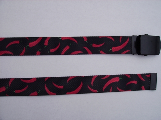 RED CHILI PEPPERS ON BLACK - High Quality U.S. Made Cotton/Polyester Non-Stretching Material with Solid Belt Buckle. These will fit all size waists from 8" up to 48" by un-clamping Buckle and cutting off extra material on non-metal end. Then just re-clamp Material. BELT-UA220N48LEAF
