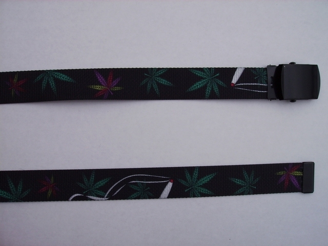 MARIJUANA LEAF - High Quality U.S. Made Cotton/Polyester Non-Stretching Material with Solid Belt Buckle. These will fit all size waists from 8" up to 48" by un-clamping Buckle and cutting off extra material on non-metal end. Then just re-clamp Material. BELT-UA220N48LEAF