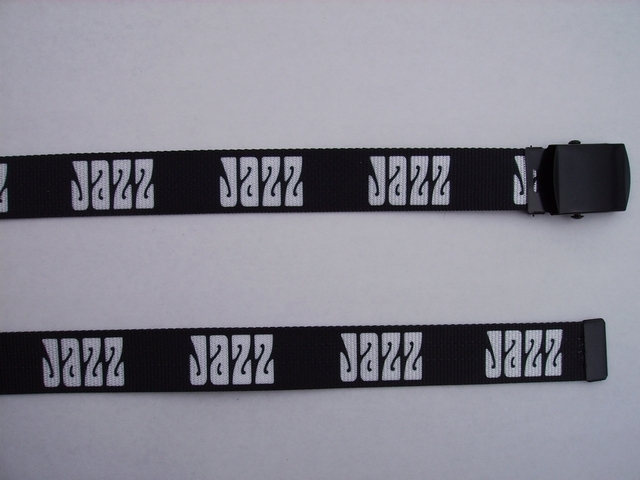 JAZZ GREY LETTERS ON BLACK - High Quality U.S. Made Cotton/Polyester Non-Stretching Material with Solid Belt Buckle. These will fit all size waists from 8" up to 48" by un-clamping Buckle and cutting off extra material on non-metal end. Then just re-clamp Material. BELT- UA220N48JZGY
