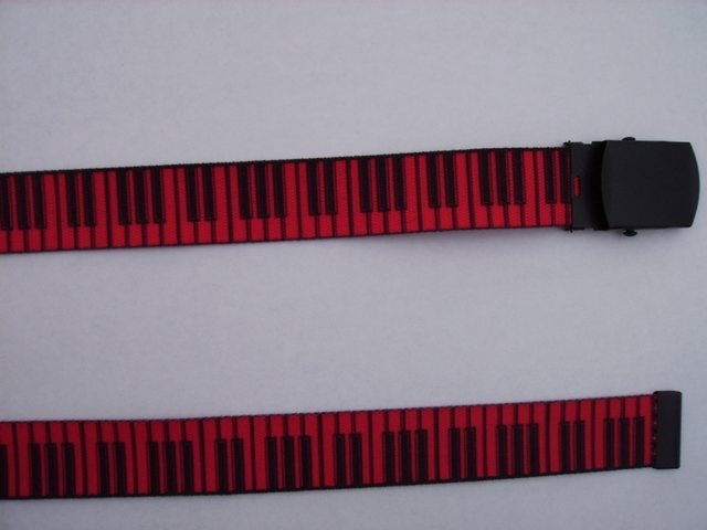 BLACK KEYS ON RED - High Quality U.S. Made Cotton/Polyester Non-Stretching Material with Solid Belt Buckle. These will fit all size waists from 8" up to 48" by un-clamping Buckle and cutting off extra material on non-metal end. Then just re-clamp Material. BELT- UB220N48PIRE