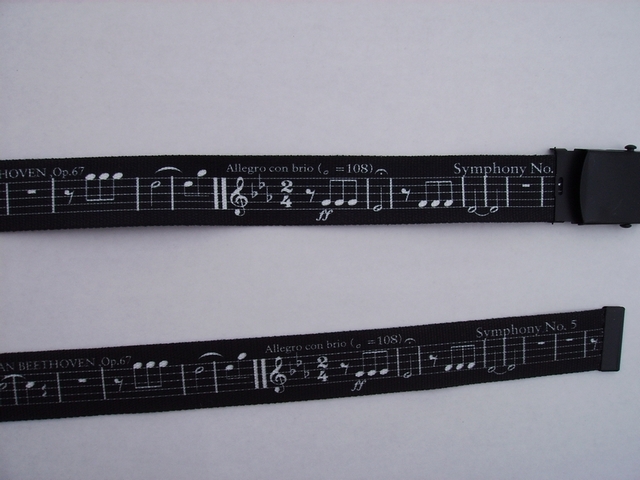 WHITE MUSIC SCORE ON BLACK - High Quality U.S. Made Cotton/Polyester Non-Stretching Material with Solid Belt Buckle. These will fit all size waists from 8" up to 48" by un-clamping Buckle and cutting off extra material on non-metal end. Then just re-clamp Material. BELT-UA220N48MUBK