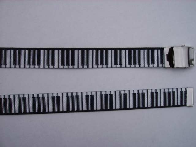 PIANO WHITE KEYS ON BLACK - High Quality U.S. Made Cotton/Polyester Non-Stretching Material with Solid Belt Buckle. These will fit all size waists from 8" up to 48" by un-clamping Buckle and cutting off extra material on non-metal end. Then just re-clamp Material. BELT-UB220N48PIBK