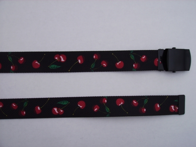 RED CHERRIES ON BLACK - High Quality U.S. Made Cotton/Polyester Non-Stretching Material with Solid Belt Buckle. These will fit all size waists from 8" up to 48" by un-clamping Buckle and cutting off extra material on non-metal end. Then just re-clamp Material. BELT-UA220N48CHBK