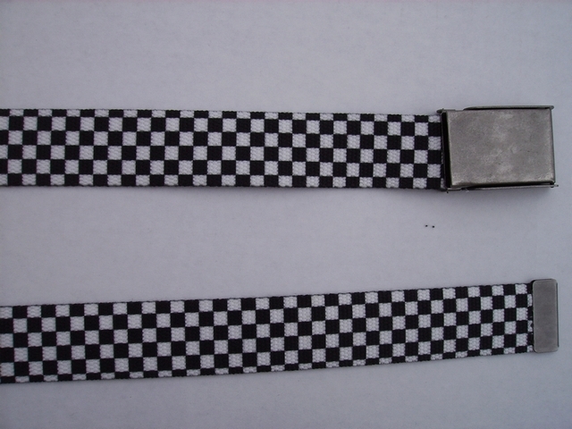 CHECKERS BLACK AND WHITE- High Quality U.S. Made Cotton/Polyester Non-Stretching Material with Solid Belt Buckle. These will fit all size waists from 8" up to 48" by un-clamping Buckle and cutting off extra material on non-metal end. Then just re-clamp Material. BELT-UA220N48CHEC