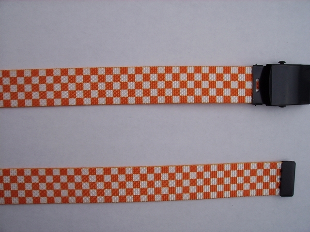 CHECKERS ORANGE AND WHITE - High Quality U.S. Made Cotton/Polyester Non-Stretching Material with Solid Belt Buckle. These will fit all size waists from 8" up to 48" by un-clamping Buckle and cutting off extra material on non-metal end. Then just re-clamp Material. BELT-220N48CKOW