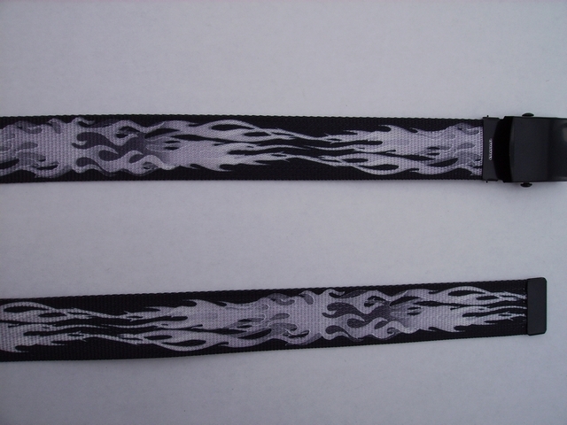 FLAMES GREY ON BLACK - High Quality U.S. Made Cotton/Polyester Non-Stretching Material with Solid Belt Buckle. These will fit all size waists from 8" up to 48" by un-clamping Buckle and cutting off extra material on non-metal end. Then just re-clamp Material. BELT-UA250K48FLGY