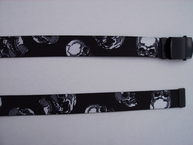 SKULLS WHITE SKULLS ON BLACK - High Quality U.S. Made Cotton/Polyester Non-Stretching Material with Solid Belt Buckle. These will fit all size waists from 8" up to 48" by un-clamping Buckle and cutting off extra material on non-metal end. Then just re-clamp Material. BELT-UA250K48SKULL