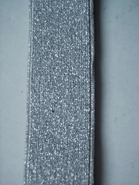 SILVER GLITTER "X" STYLE 1 1/4"X54" long  FRENCH SATIN FINISH Suspenders with 4 strong 1/2"X1" CHROME GRIPS and  2 strong CHROME adjusters in front and 1 CHROME adjuster in the back.      GF760N54SILV